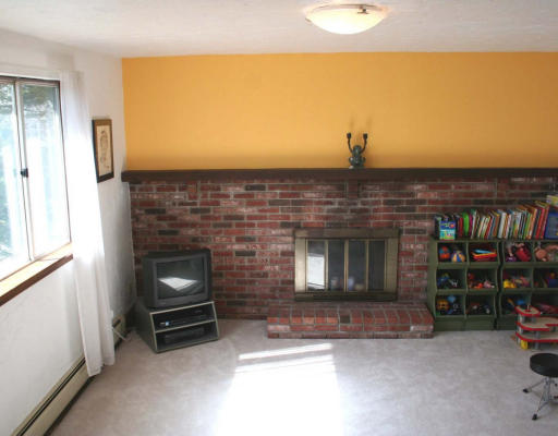 53 Upland Road West Arlington, MA 02474 - Photo 9 of 11 a living room with furniture and a fireplace