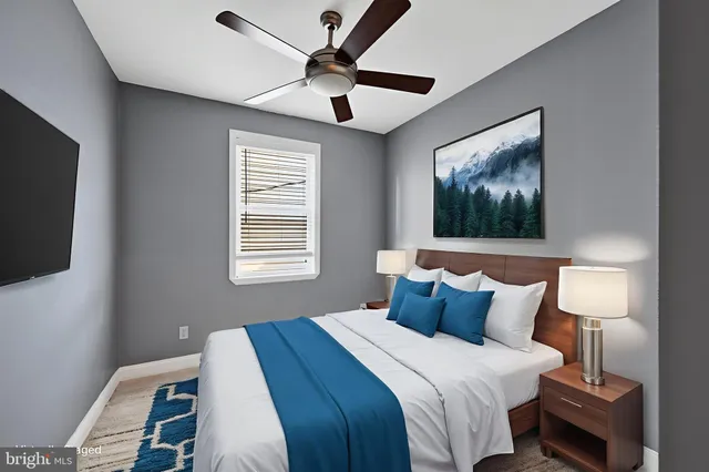 a bedroom with a bed and a flat screen tv