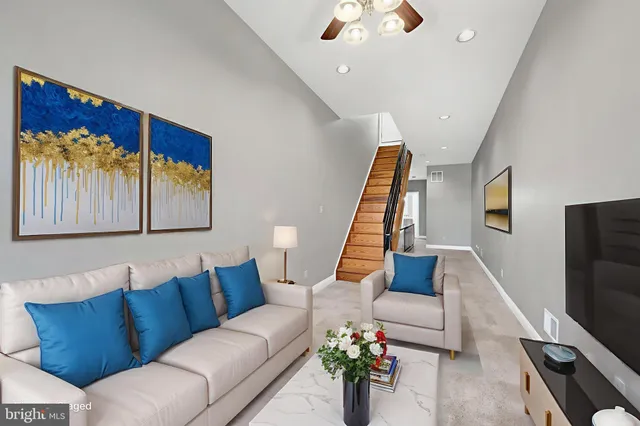 a living room with furniture fireplace and a flat screen tv