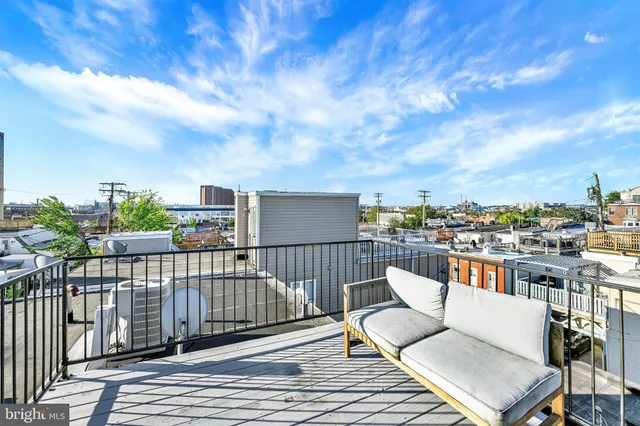 a view of a balcony with furniture