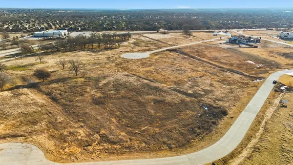 an aerial view of residential building and parking space