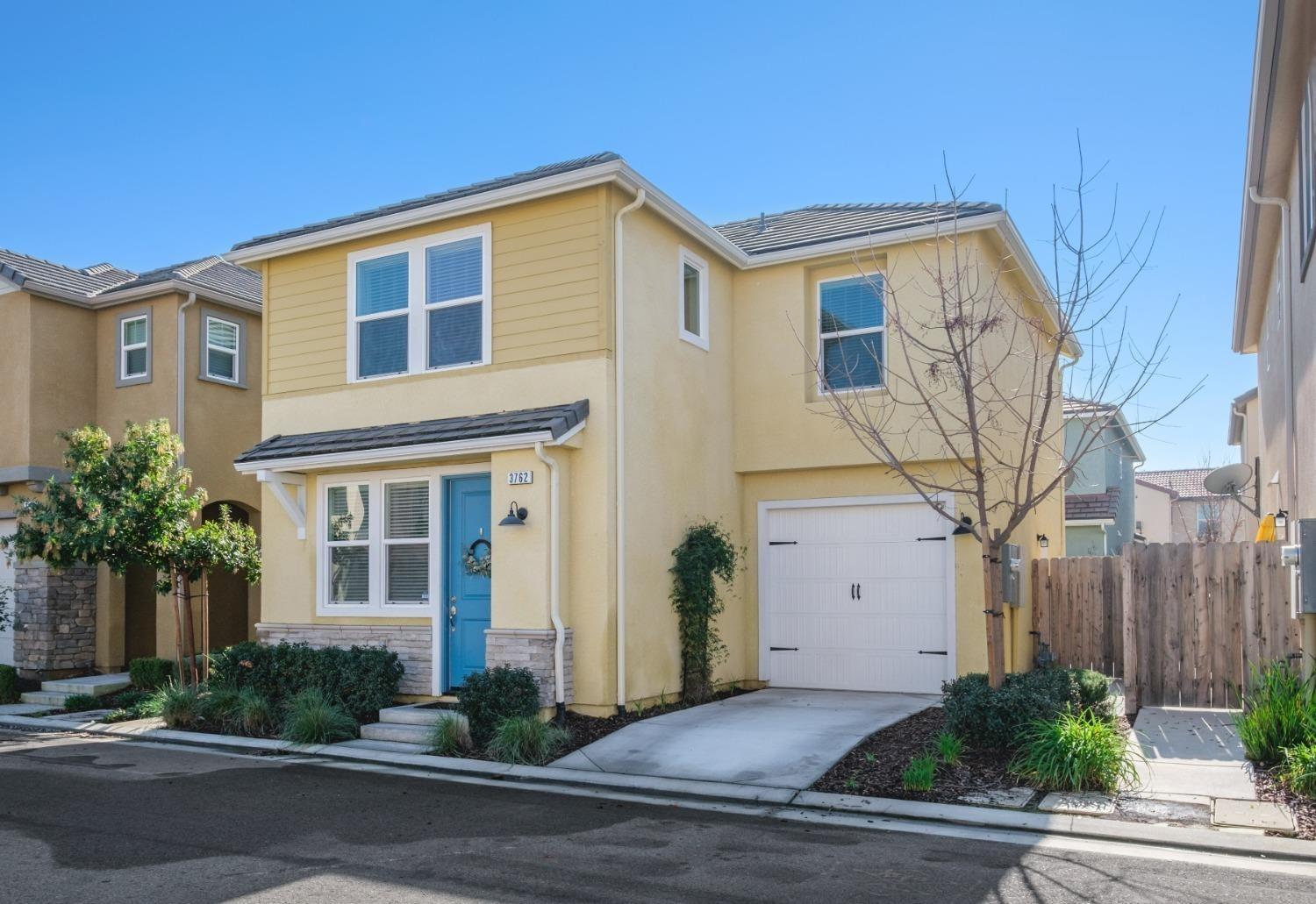 a front view of a house with garage
