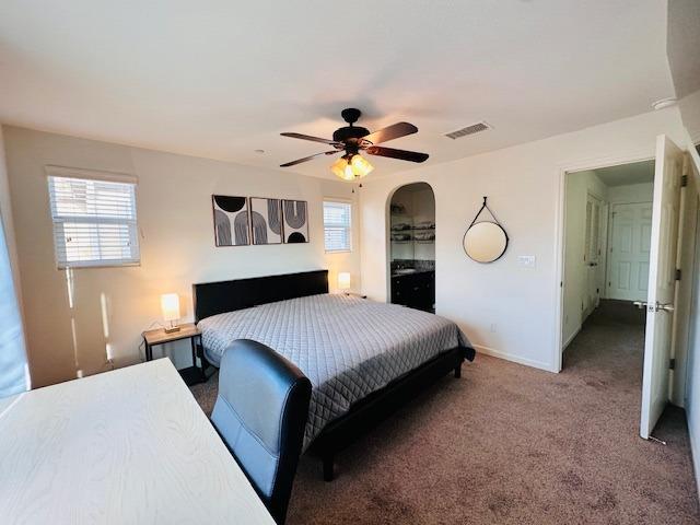 3762 Amity Lane Clovis, CA 93619 - Photo 11 of 15 a bed room with a bed and a chandelier