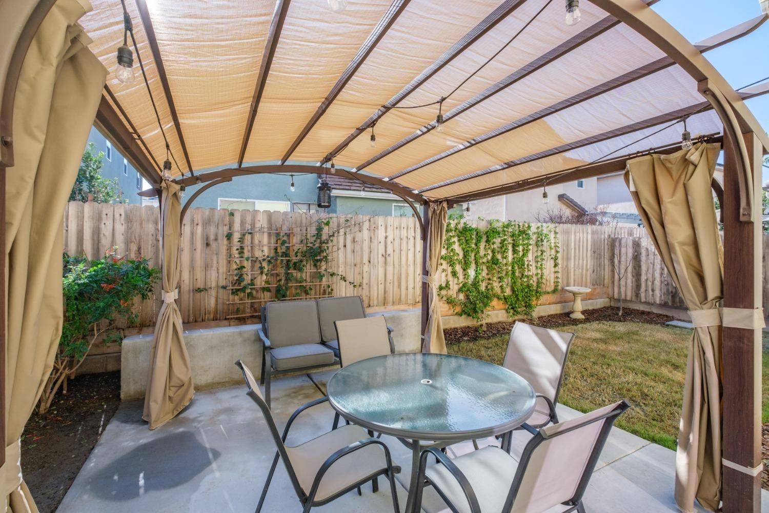 3762 Amity Lane Clovis, CA 93619 - Photo 14 of 15 a dining room with furniture window and wooden floor