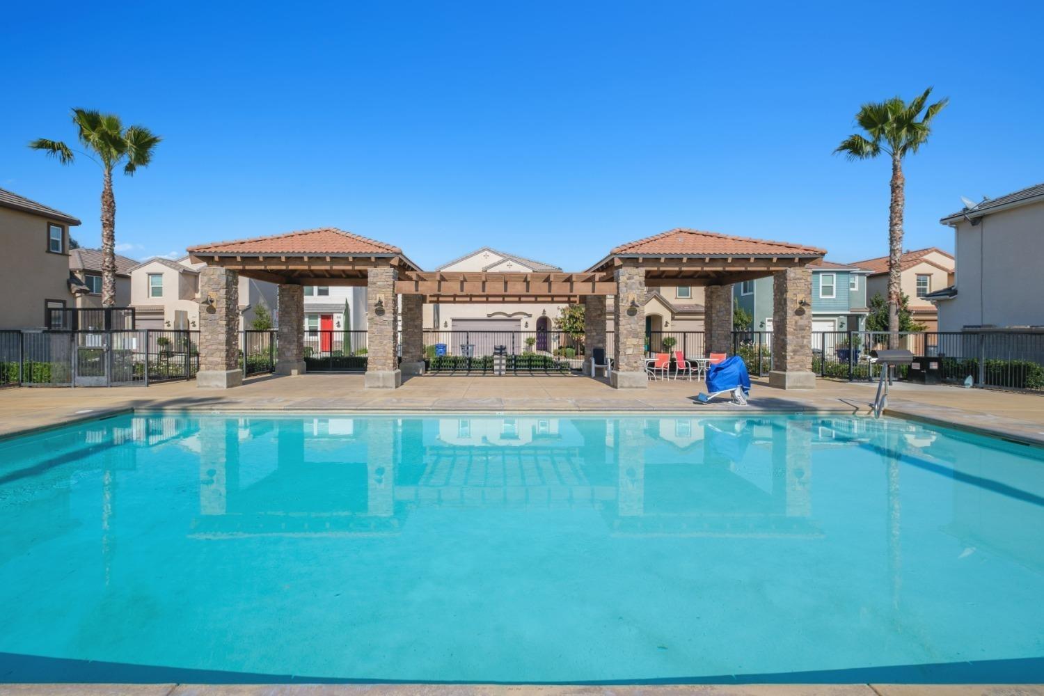 3762 Amity Lane Clovis, CA 93619 - Photo 15 of 15 a view of a house with a swimming pool