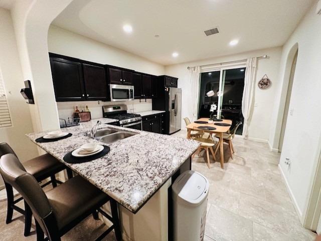 3762 Amity Lane Clovis, CA 93619 - Photo 5 of 15 a view of a dining room with furniture