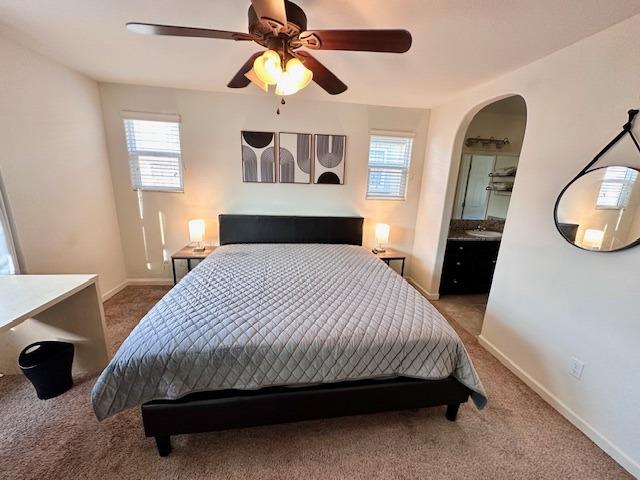 3762 Amity Lane Clovis, CA 93619 - Photo 10 of 15 a bedroom with a large bed and a chandelier