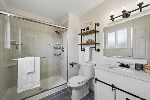 a bathroom with a shower and a toilet