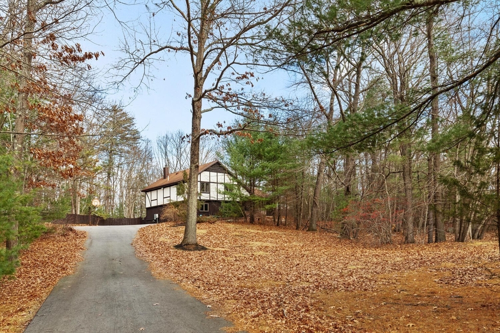 13 Dix Road Ipswich, MA 01938 - Photo 1 of 30 a sign board with yard and trees