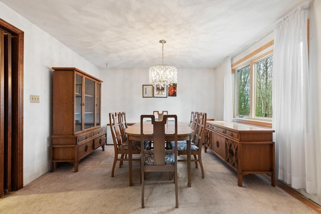 13 Dix Road Ipswich, MA 01938 - Photo 17 of 30 a view of a dining room with furniture window and outside view