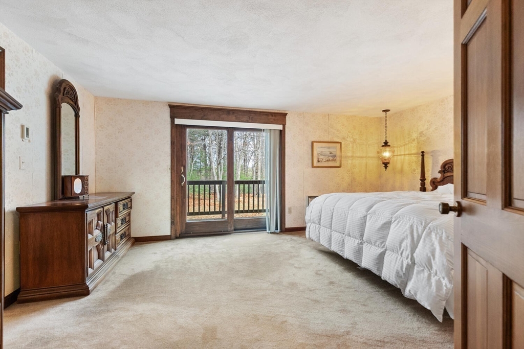 13 Dix Road Ipswich, MA 01938 - Photo 20 of 30 a bedroom with a bed next to a window with outer view