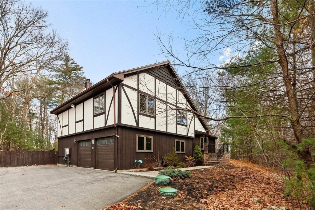 13 Dix Road Ipswich, MA 01938 - Photo 2 of 30 a front view of a house with a yard and garage