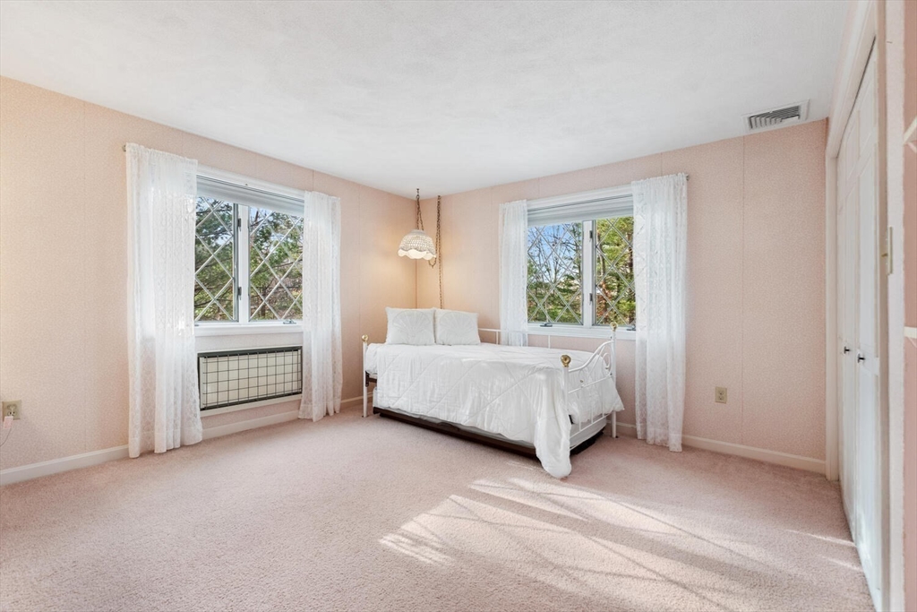 13 Dix Road Ipswich, MA 01938 - Photo 24 of 30 a bedroom with a bed and a window