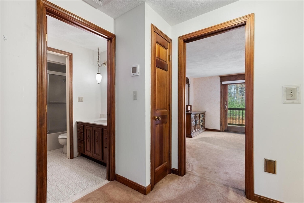 13 Dix Road Ipswich, MA 01938 - Photo 26 of 30 a view of a hallway with closet and a mirror