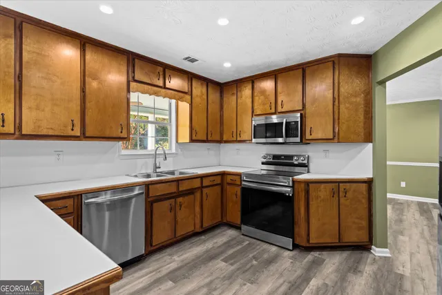 a bathroom with a double vanity sink and mirror