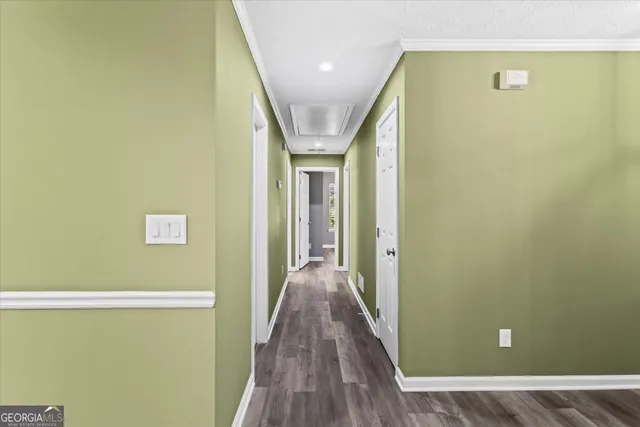 a view of a room with wooden floor and window