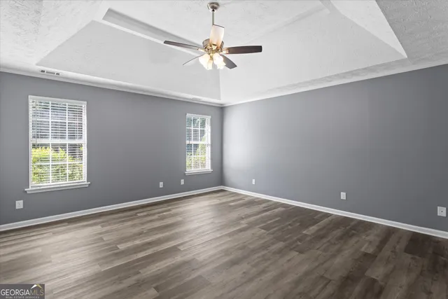 a bathroom with a double vanity sink toilet and shower