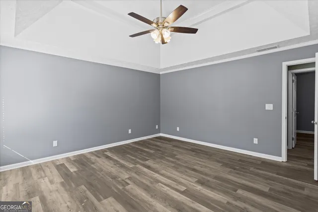 a bathroom with a sink double vanity granite tub and a mirror