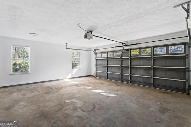 a view of a house with large trees