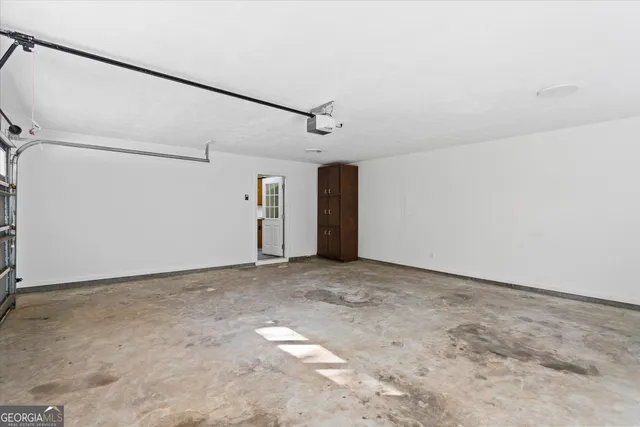 a front view of a house with a yard garage and outdoor seating
