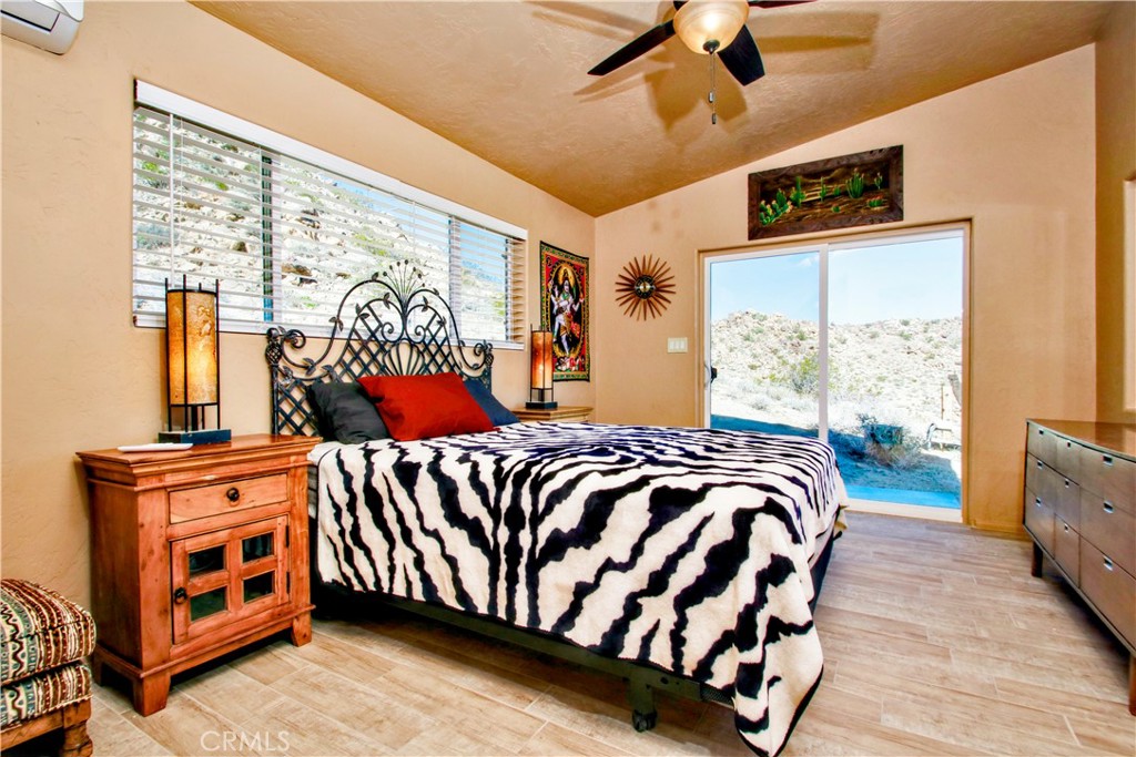 4650 Sizer Canyon Road Johnson Valley, CA 92285 - Photo 17 of 36 a bed sitting in a bedroom next to a window