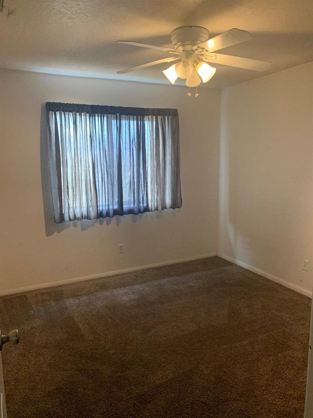 15006 Temecula Road Apple Valley, CA 92307 - Photo 12 of 13 a view of a livingroom with a fan