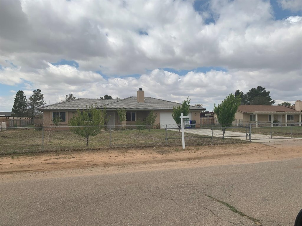 15006 Temecula Road Apple Valley, CA 92307 - Photo 3 of 13 a view of a house with a yard