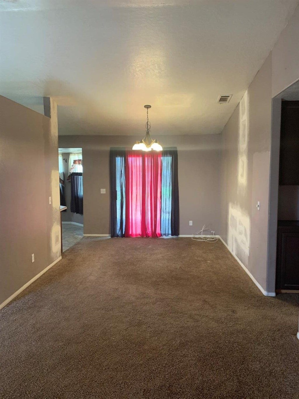 15006 Temecula Road Apple Valley, CA 92307 - Photo 6 of 13 a view of an empty room with a window