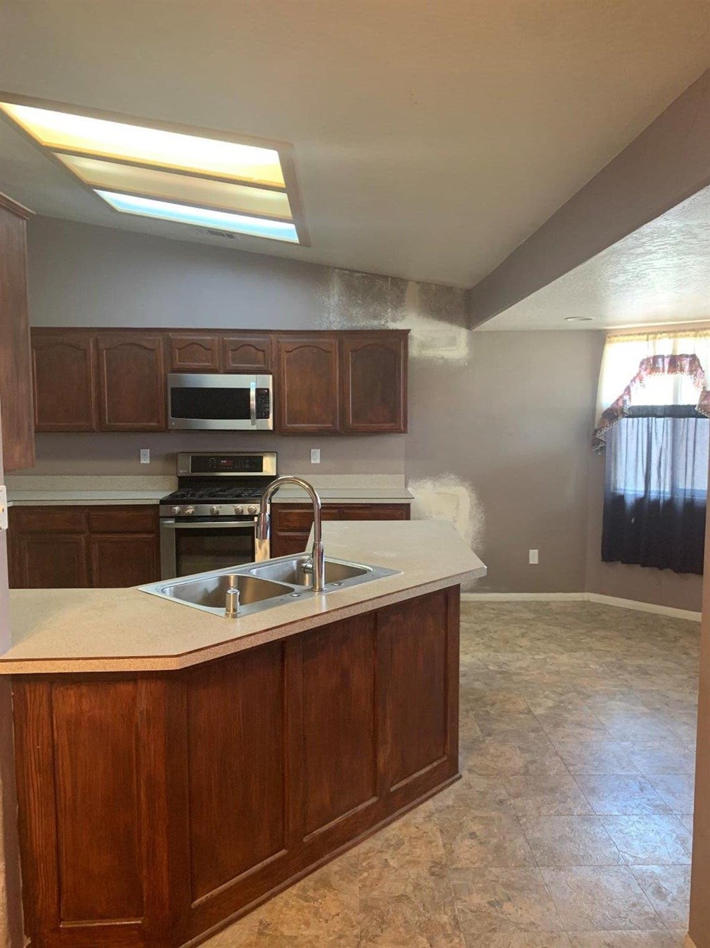 15006 Temecula Road Apple Valley, CA 92307 - Photo 7 of 13 a kitchen with a sink and a stove