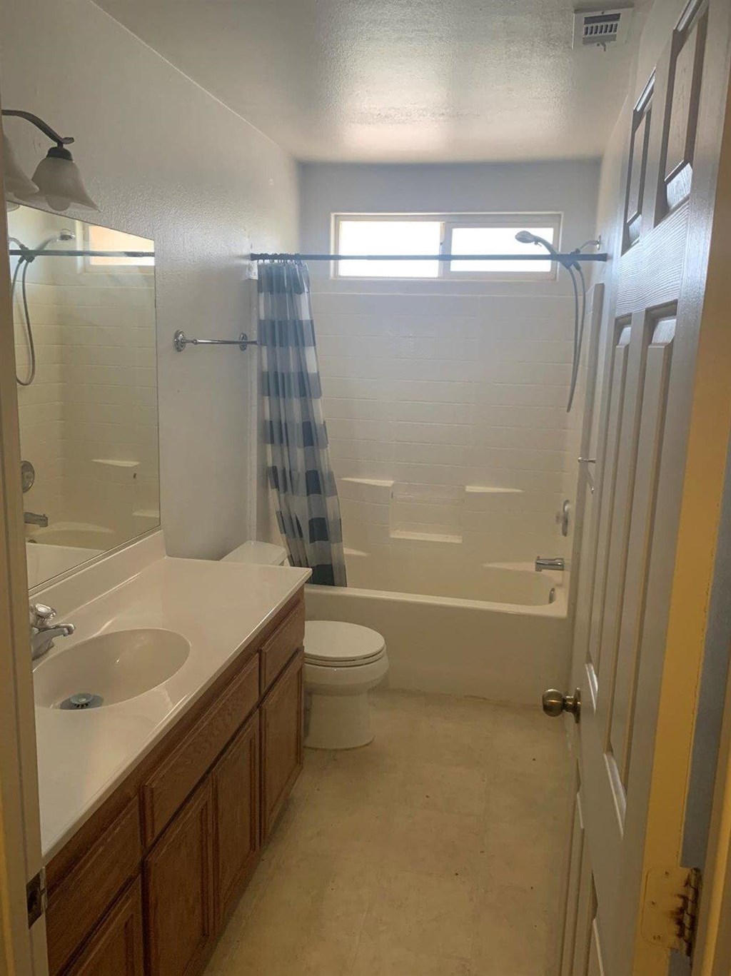 15006 Temecula Road Apple Valley, CA 92307 - Photo 10 of 13 a bathroom with a granite countertop shower a toilet and a sink