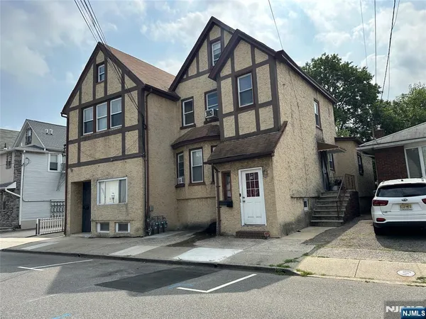 a view of a car park in front of house