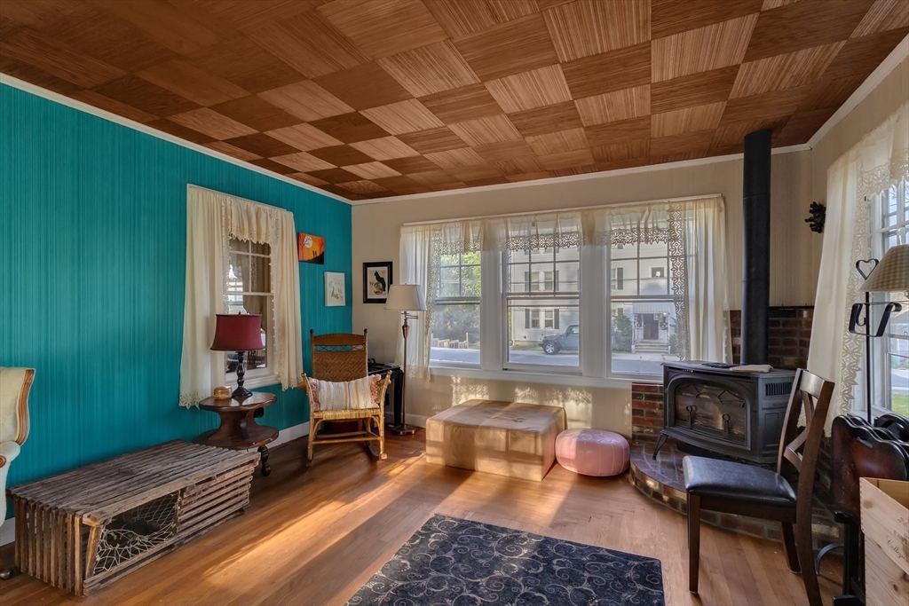 22 Williams Street Dudley, MA 01571 - Photo 11 of 33 a living room with furniture and a large window