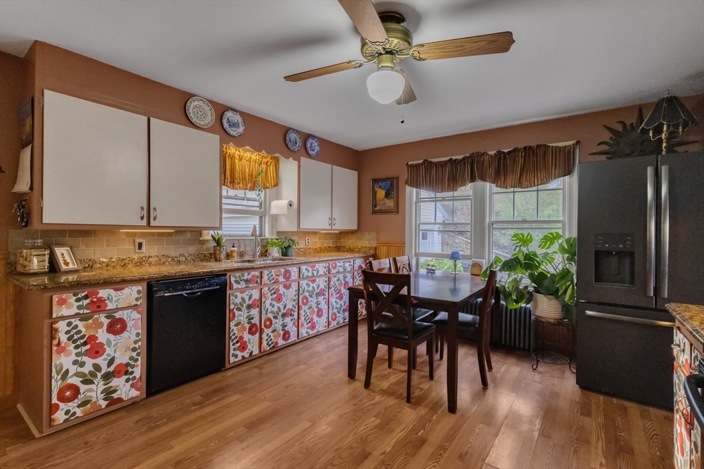22 Williams Street Dudley, MA 01571 - Photo 14 of 33 a kitchen with granite countertop stainless steel appliances dining table and chairs