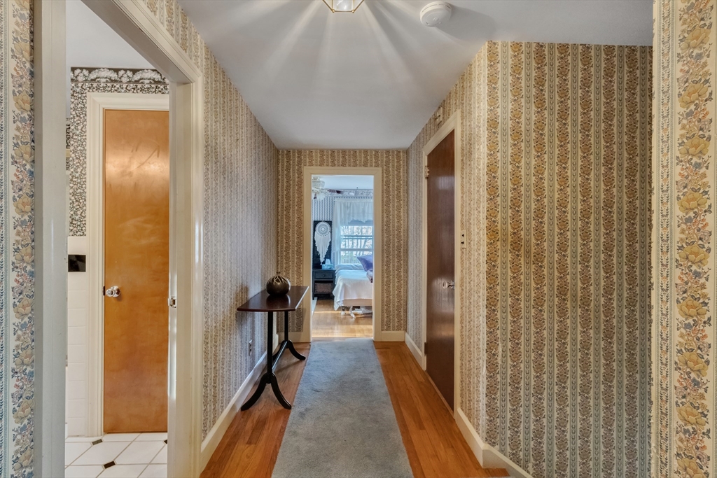 22 Williams Street Dudley, MA 01571 - Photo 17 of 33 a view of a hallway with wooden floor and staircase