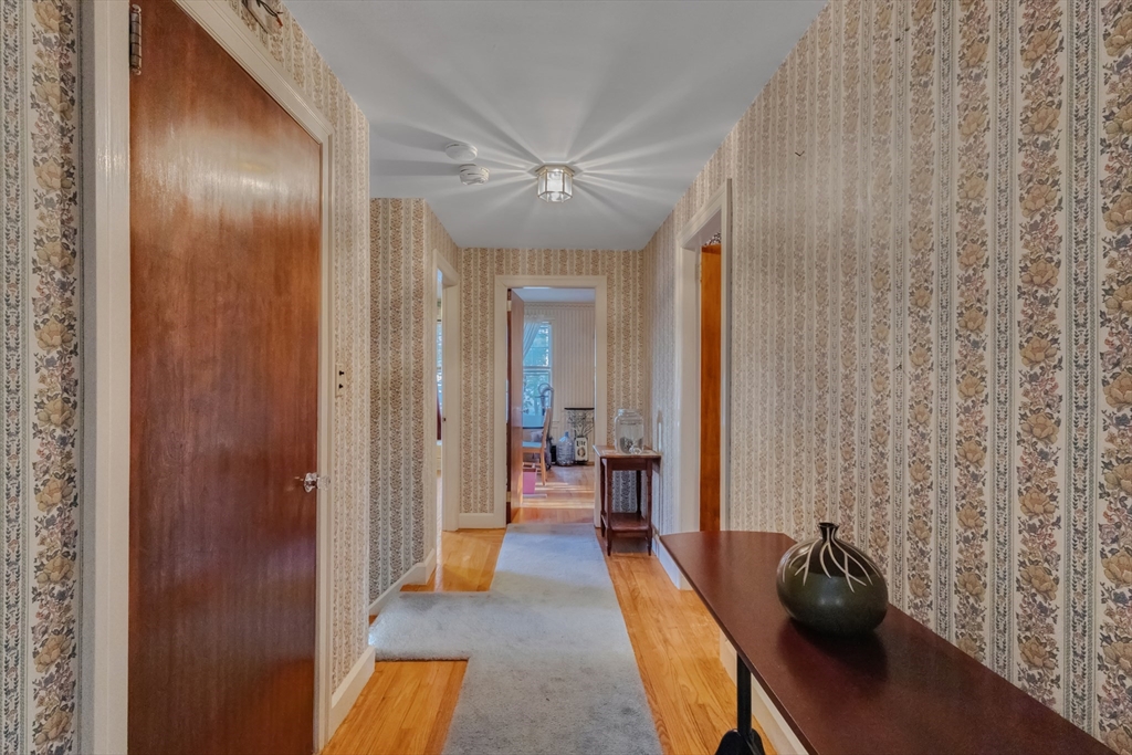22 Williams Street Dudley, MA 01571 - Photo 18 of 33 a view of a hallway with couch and chandelier