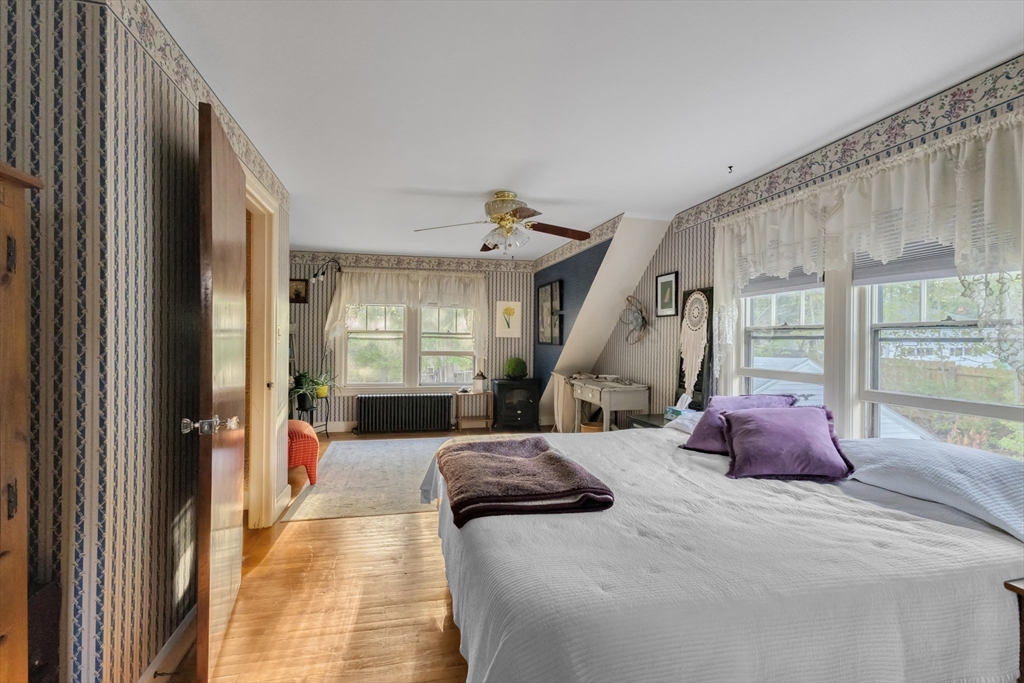 22 Williams Street Dudley, MA 01571 - Photo 19 of 33 a bedroom with furniture and a large window