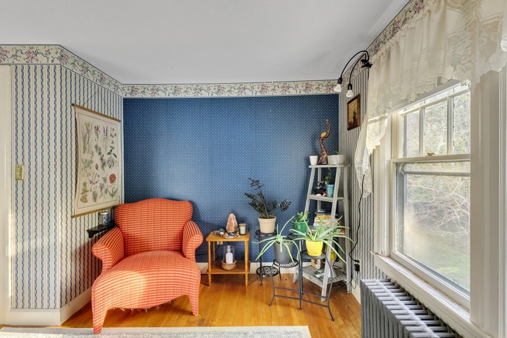 22 Williams Street Dudley, MA 01571 - Photo 21 of 33 a living room with furniture and a floor to ceiling window