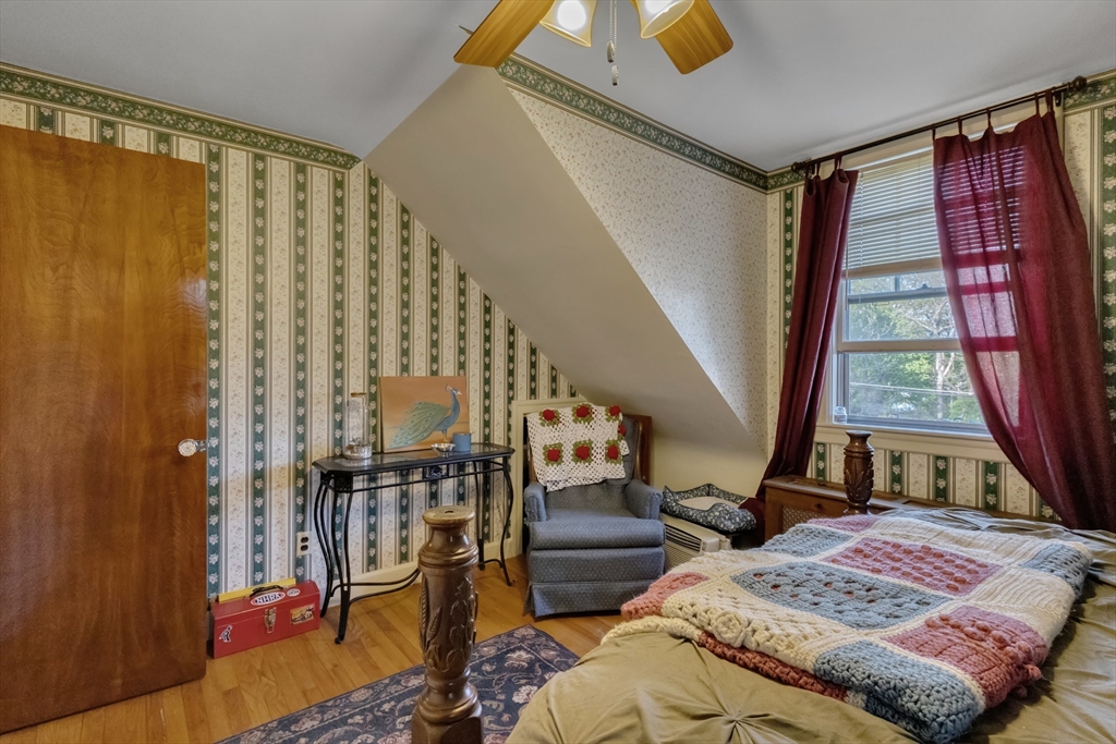 22 Williams Street Dudley, MA 01571 - Photo 23 of 33 a bed sitting in a bedroom next to a window