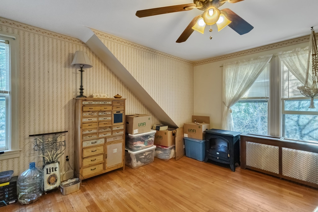22 Williams Street Dudley, MA 01571 - Photo 25 of 33 a view of an empty room with a window and wooden floor