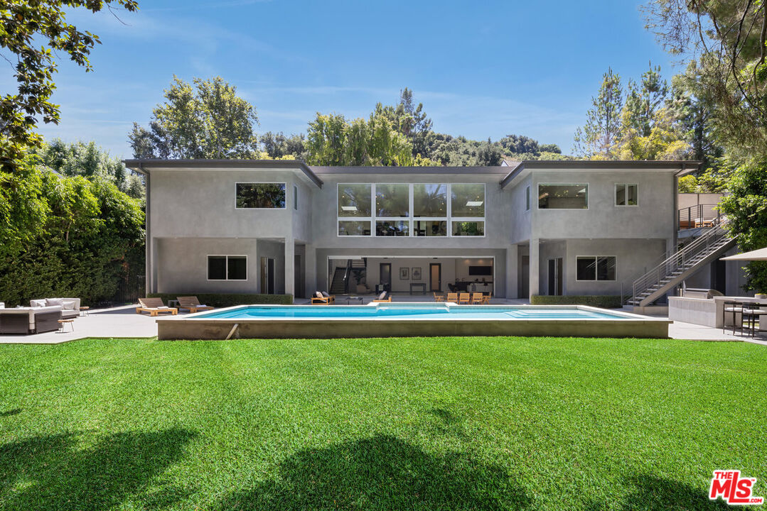15641 Meadowgate Road Encino, CA 91436 - Photo 1 of 32 a front view of house with yard and outdoor seating