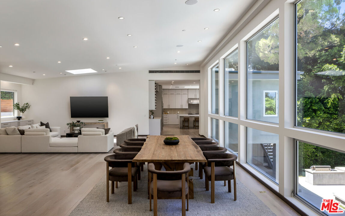 15641 Meadowgate Road Encino, CA 91436 - Photo 12 of 32 a view of a dining room with furniture window and wooden floor