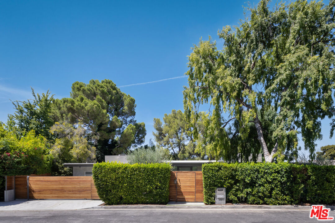 15641 Meadowgate Road Encino, CA 91436 - Photo 2 of 32 a view of a street with a tree