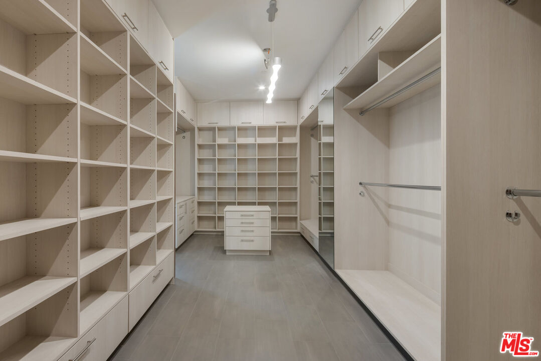 15641 Meadowgate Road Encino, CA 91436 - Photo 23 of 32 a view of walk in closet with empty racks