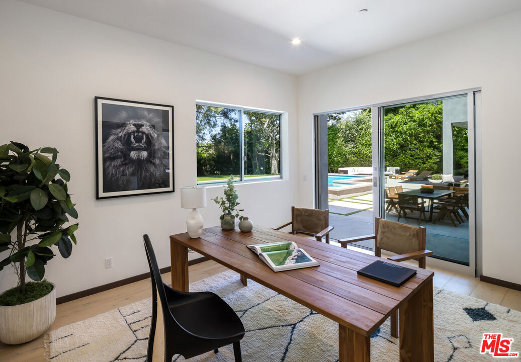 15641 Meadowgate Road Encino, CA 91436 - Photo 31 of 32 a workspace with furniture and a potted plant