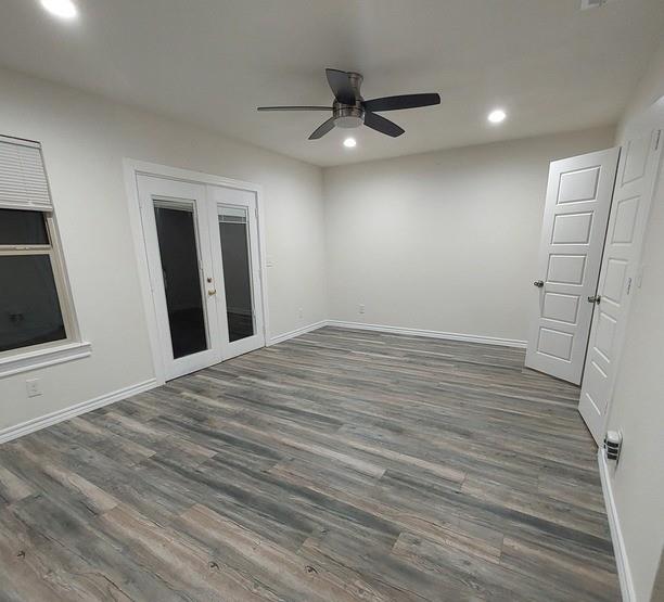 814 Chestnut Street Bonham, TX 75418 - Photo 2 of 12 a view of a livingroom with wooden floor and a ceiling fan