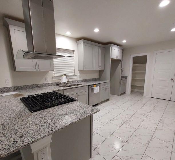 814 Chestnut Street Bonham, TX 75418 - Photo 6 of 12 a kitchen with granite countertop a sink stove and cabinets