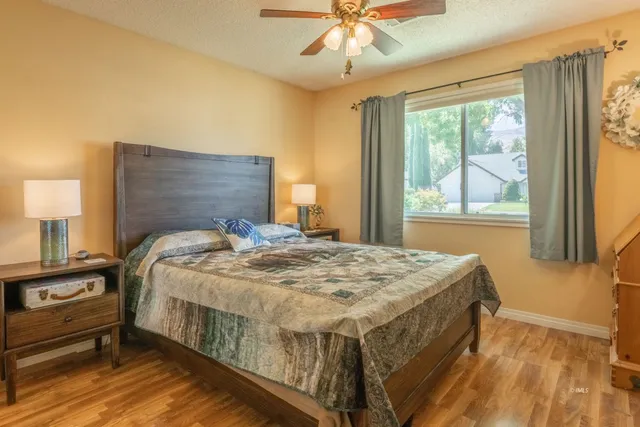 a bedroom with a bed and window