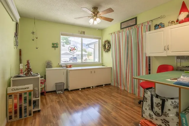 a workspace with furniture window and wooden floor