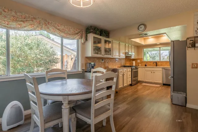 a open kitchen with a table and chairs
