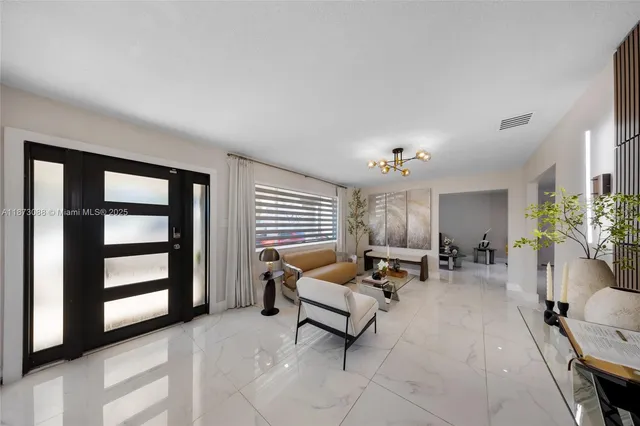 a living room with furniture and window